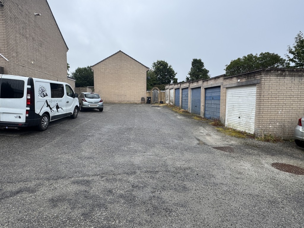 Lot: 10 - BLOCK OF SEVEN FREEHOLD GARAGES AND ROADWAY - View from entrance point of garages and roadway